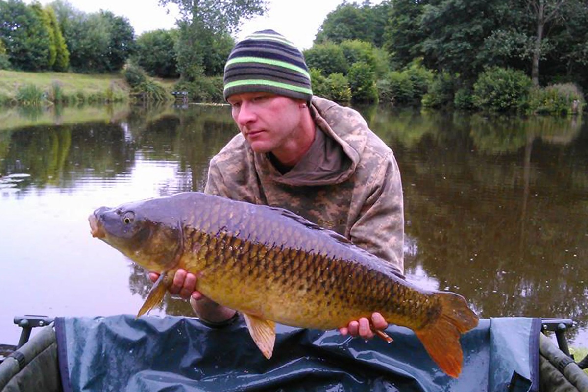 A person holding a large fish