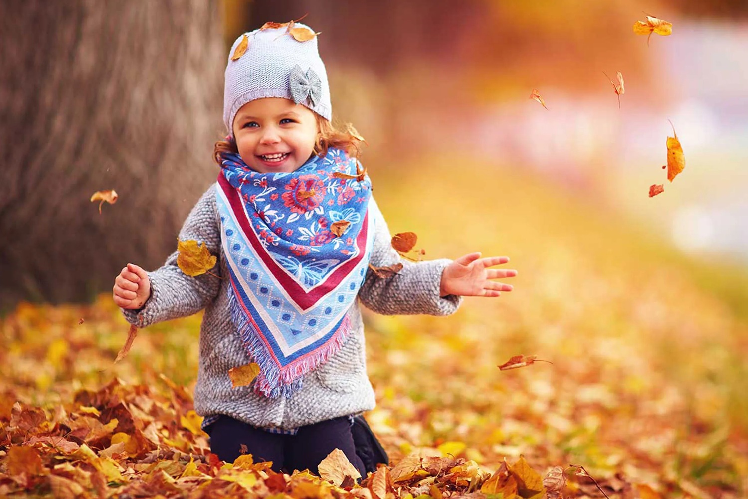 A child at Arley Arboretum in autumn
